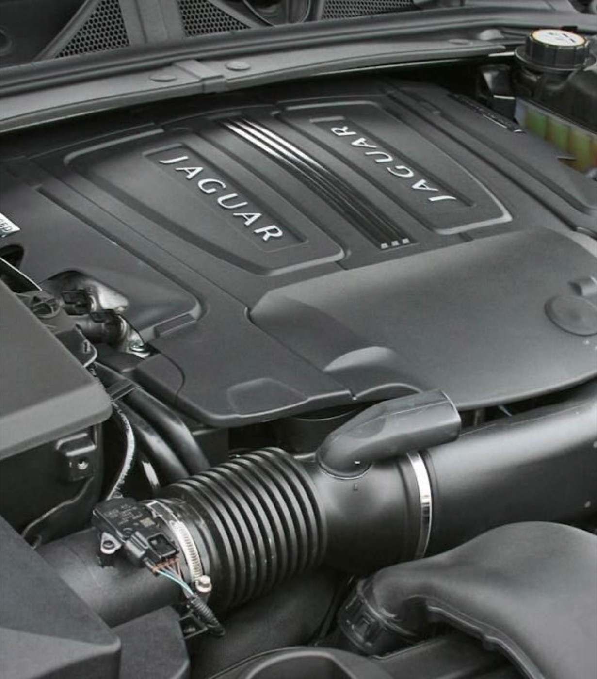 Jaguar XF engine cover — service performed by James Ryan Becker
